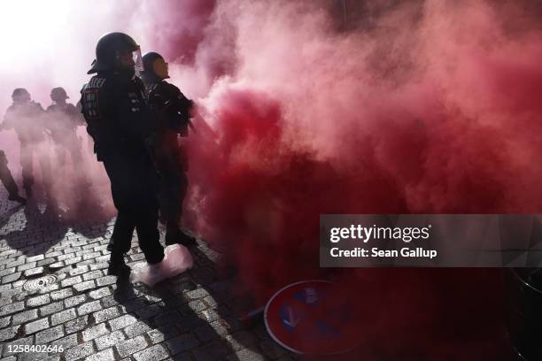 Riot police advance through smoke bombs thrown by Leftist demonstrators during "Day X" protests on June 3, 2023 in Leipzig, Germany. Protesters took...