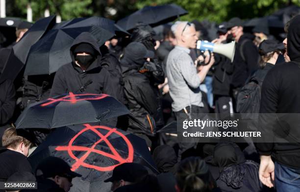 Demonstrators protest during a so-called "national day of action" organised by far-left activists on June 3, 2023 in Leipzig, eastern Germany,...