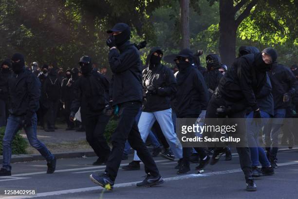 Leftist demonstrators hurl cobblestones as they clash with police during "Day X" protests on June 3, 2023 in Leipzig, Germany. Protesters took to the...