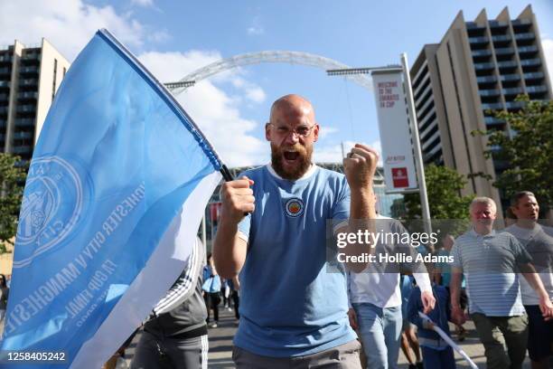 Manchester City fans celebrate outside Wembley Stadium after Manchester City won the FA Cup Final on June 3, 2023 in London, England. Manchester...