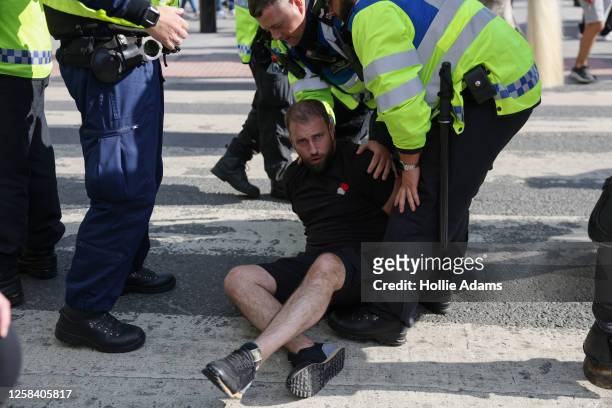 Football fan is arrested outside Wembley Stadium after Manchester City won the FA Cup Final on June 3, 2023 in London, England. Manchester United and...