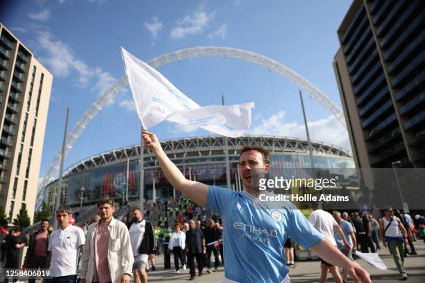 Manchester City fans celebrate outside Wembley Stadium after Manchester City won the FA Cup Final on June 3, 2023 in London, England. Manchester...