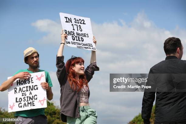 Animal Rising supporters gather outside the main grandstand with signs criticising horse racing on June 3, 2023 in Epsom, England. Protesters from...