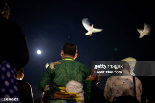Buddhist release white pigeon as a symbol of peace during the Larung Pelita Purnama Sidhi Festival on the Progo River, Magelang, Central Java, on...