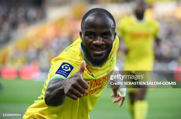 Nantes' Cameroonian forward Ignatius Ganago celebrates after scoring the first goal for his team during the French L1 football match between FC...