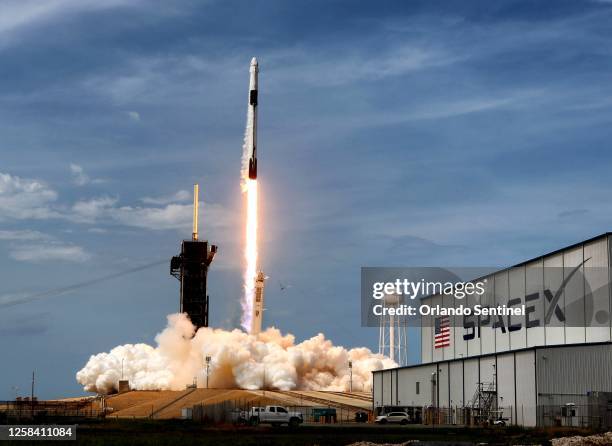 The SpaceX Falcon 9 rocket carrying astronauts Doug Hurley and Bob Behnken in the Crew Dragon capsule lifts off from Kennedy Space Center, Florida,...