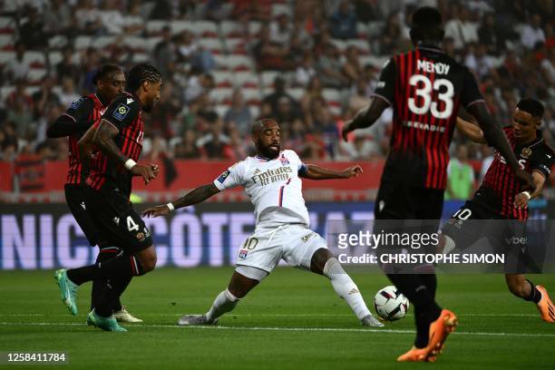 Lyon's French forward Alexandre Lacazette fights for the ball during the French L1 football match between OGC Nice and Olympique Lyonnais at the...