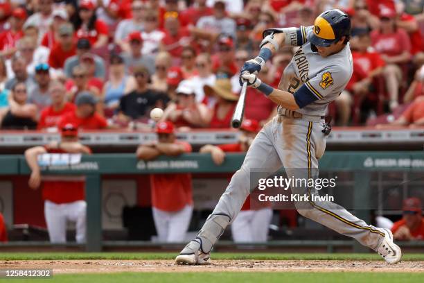 Christian Yelich of the Milwaukee Brewers hits an RBI single during the second inning of the game against the Cincinnati Reds at Great American Ball...