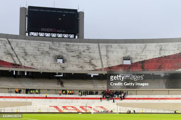 Police officers work in the perimeter where a fan died after falling down from the stands following the suspension of River Plate and of Defensa y...