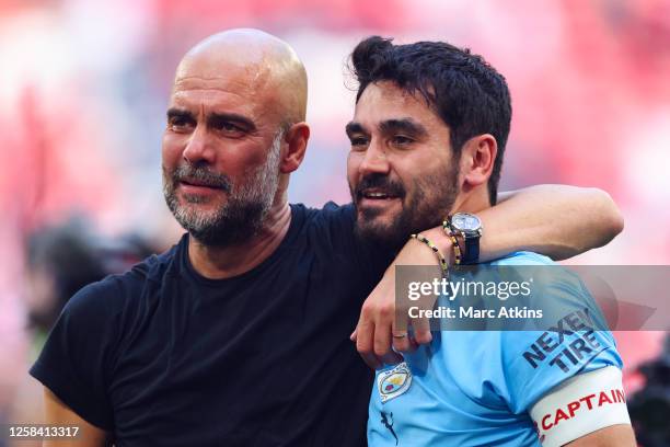 Pep Guardiola manager of Manchester City celebrates with Ilkay Gundogan after the Emirates FA Cup Final match between Manchester City and Manchester...