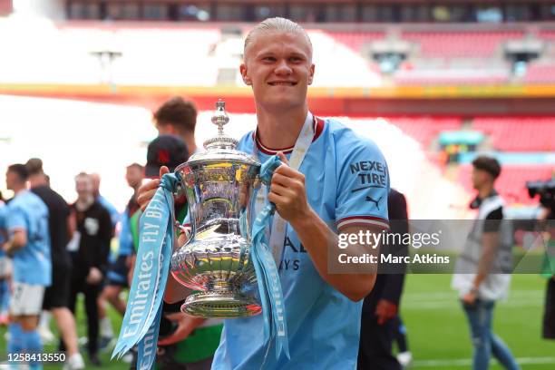 Erling Haaland of Manchester City celebrates with the trophy during the Emirates FA Cup Final match between Manchester City and Manchester United at...
