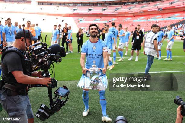 Ilkay Gundogan of Manchester City celebrates with the trophy during the Emirates FA Cup Final match between Manchester City and Manchester United at...