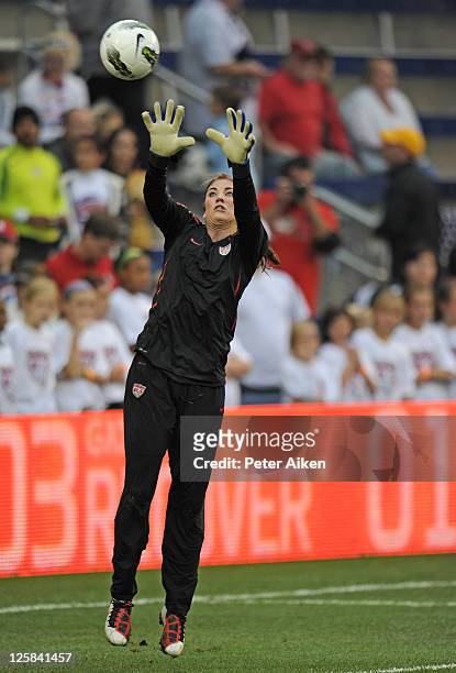 Goal Keeper Hope Solo of the United States goes up for a ball during pre-game warm up drills before a game against Canada on September 17, 2011 at...