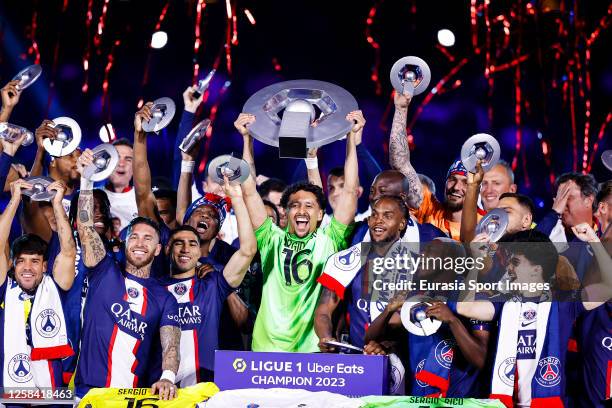 Marcos Correa of Paris Saint Germain rise the champions trophy while celebrates with his teammates after winning France Ligue 1 2023 during the Ligue...