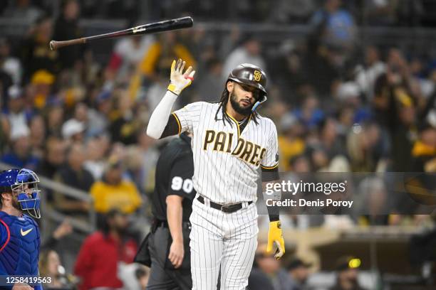 Fernando Tatis Jr. #23 of the San Diego Padres tosses his bat after hitting a solo home run during the third inning against the Chicago Cubs at Petco...