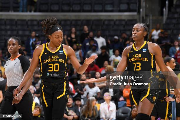 Nneka Ogwumike and Chiney Ogwumike of the Los Angeles Sparks high five during the game against the Seattle Storm on June 3, 2023 at Crypto.Com Arena...