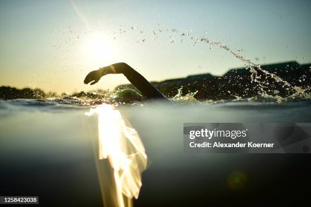 Athletes compete during the swim leg at sunrise at the IRONMAN European Championship Hamburg on June 4, 2023 in Hamburg, Germany.