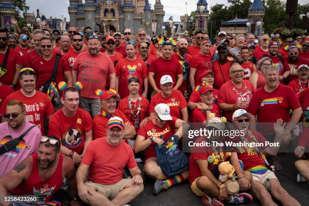 Participants of "Gay day" gather to pose for a photo at Disney World's Magic Kingdom on Saturday, June 3, 2023 in Lake Buena Vista, Fla. Gay Days at...