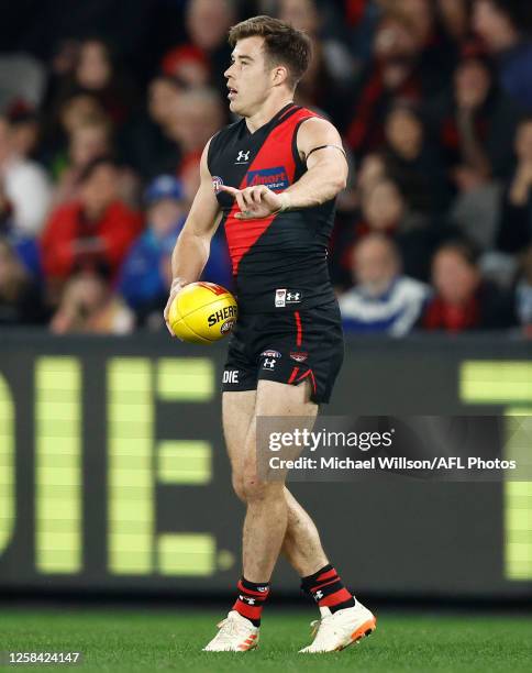 Zach Merrett of the Bombers in action during the 2023 AFL Round 12 match between the Essendon Bombers and the North Melbourne Kangaroos at Marvel...