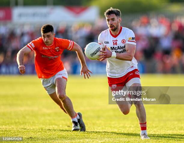 Tyrone , United Kingdom - 3 June 2023; Matthew Donnelly of Tyrone in action against Conor O'Neill of Armagh during the GAA Football All-Ireland...