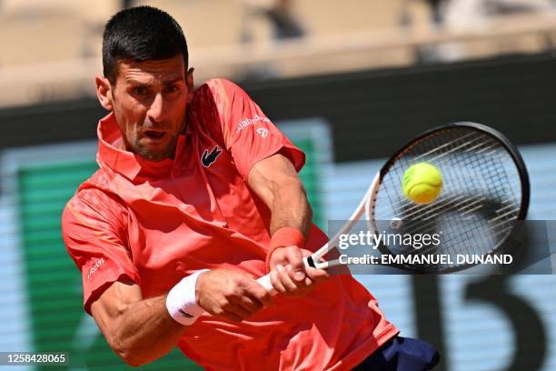 Serbia's Novak Djokovic plays a backhand return to Peru's Juan Pablo Varillas during their men's singles match on day eight of the Roland-Garros Open...