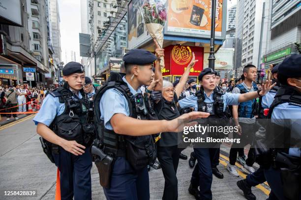 Police stop and search people at Causeway Bay in Hong Kong, China on Sunday, 4 June 2023. For almost three decades, people in Hong Kong commemorated...