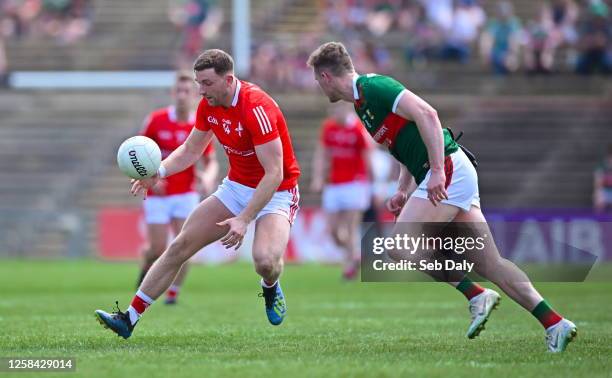 Mayo , Ireland - 4 June 2023; Sam Mulroy of Louth in action against Matthew Ruane of Mayo during the GAA Football All-Ireland Senior Championship...