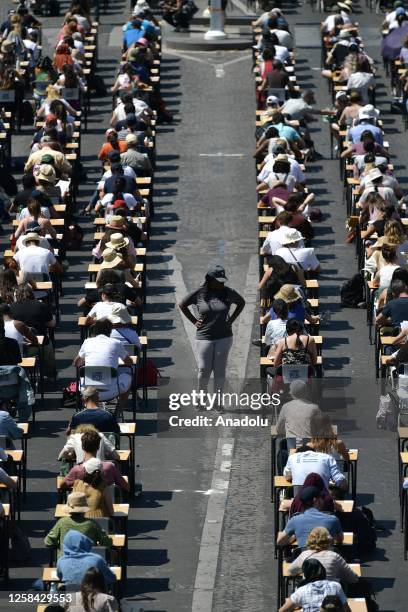 Participants perform during The Great Dictation at the avenue of the Champs-Elysees in Paris, France, on June 04, 2023.
