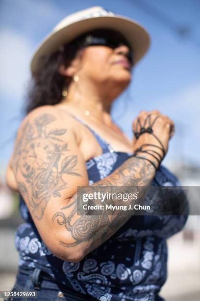 Lisa Saenz's tattoos commemorate her 37-year-old daughter. She and her husband Daniel Sanchez came to drive a 1933 Master Eagle and a 1948 Chevrolet...