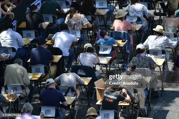 Participants perform during The Great Dictation at the avenue of the Champs-Elysees in Paris, France, on June 04, 2023.