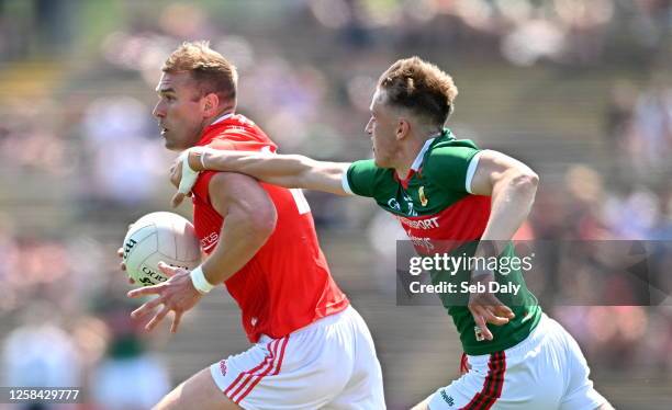 Mayo , Ireland - 4 June 2023; Conor Grimes of Louth in action against Donnacha McHugh of Mayo during the GAA Football All-Ireland Senior Championship...