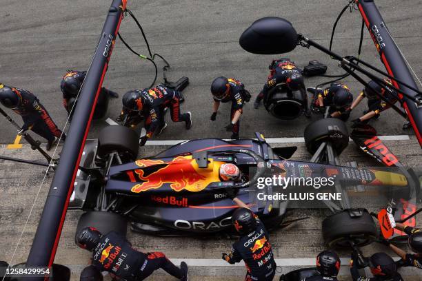 Red Bull's Dutch driver Max Verstappen changes tires in the box during the Spanish Formula One Grand Prix race at the Circuit de Catalunya on June 4,...
