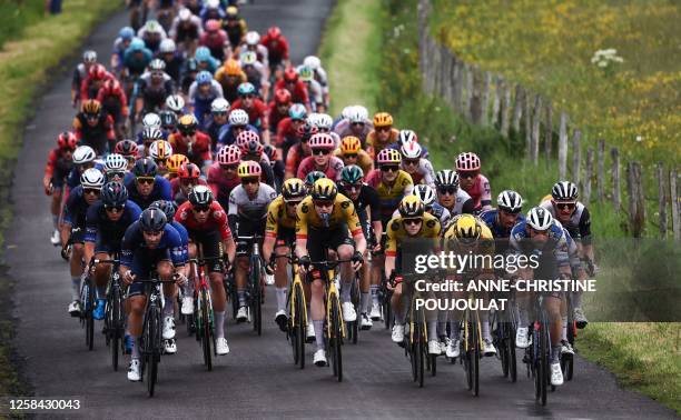 The pack rides during the first stage of the 75th edition of the Criterium du Dauphine cycling race, some 158kms between Chambon-sur-Lac to...