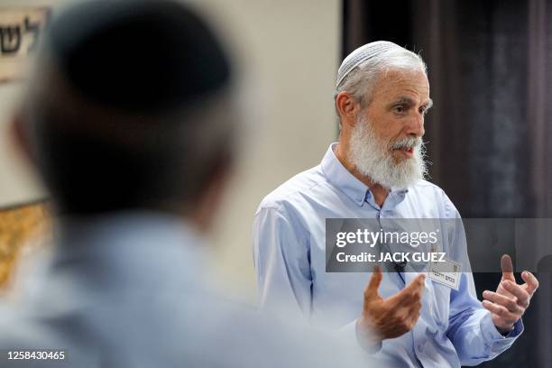 In this picture taken on April 28 director of the Temple Institute's choir Menahem Rozenthal addresses its members during rehearsals in the city of...