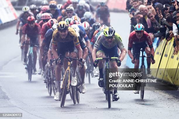 Jumbo-Visma's French rider Christophe Laporte and Intermarche - Circus - Wanty's Belgian rider Rune Herregodts compete to win the first stage of the...