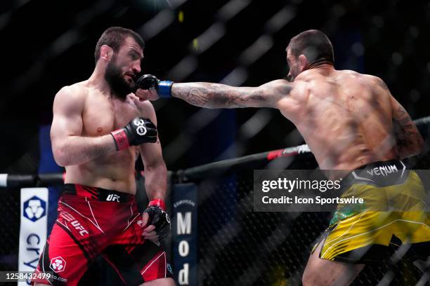 Elizeu Zaleski dos Santos punches Abubakar Nurmagomedov in a 3-round bout at UFC Apex for UFC Vegas 74 on June 3, 2023 in Las Vegas, NV.