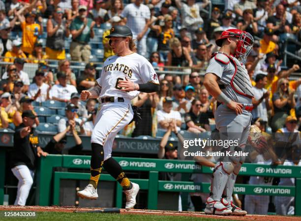 Jack Suwinski of the Pittsburgh Pirates scores on a two-RBI single in the first inning against the St. Louis Cardinals at PNC Park on June 4, 2023 in...