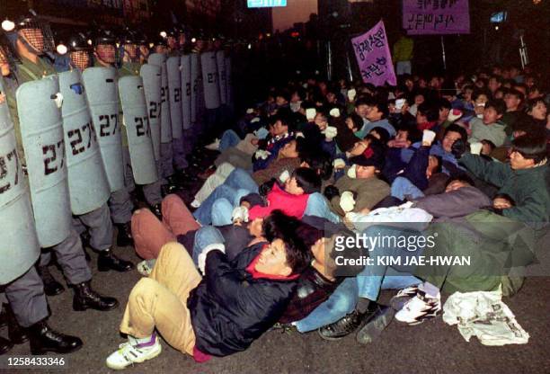 Students stage a protest in front of the U.S. Embassy in Seoul, South Korea, 15 December 1993 during a demonstration against U.S. Pressure on Seoul...