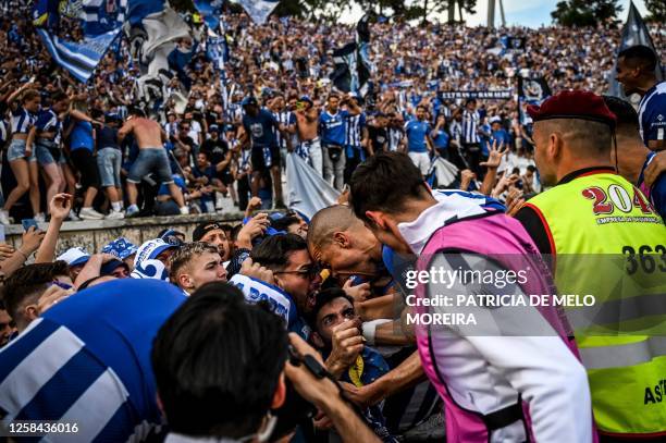 Porto's Portguese defender Pepe celebrates with Porto's supporters after Porto's Portuguese midfielder Otavio scored the second goal during the 'Taca...