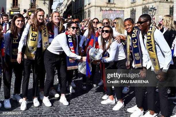 Barcelona's players celebrate with their trophy in Barcelona, on June 4, 2023 one day after winning the UEFA Women's Champions League.