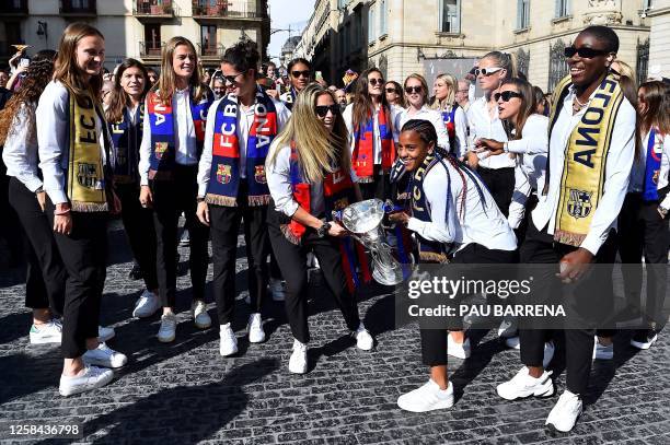 Barcelona's players celebrate with their trophy in Barcelona, on June 4, 2023 one day after winning the UEFA Women's Champions League.