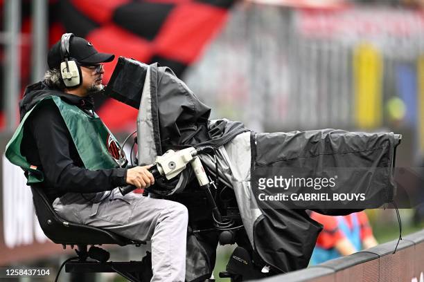 Television cameraman gets ready for the live broadcasting of the Italian Serie A football match between AC Milan and Hellas Verona on June 4, 2023 at...
