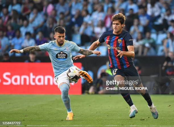 Celta Vigo's Spanish forward Carles Perez vies with Barcelona's Spanish defender Marcos Alonso during the Spanish league football match between RC...