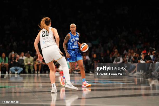 Courtney Williams of the Chicago Sky handles the ball against defender Sabrina Ionescu of the New York Liberty during the game on June 4, 2023 in...