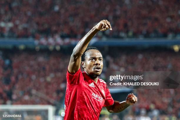 Ahly's South African forward Percy Tau celebrates after scoring a goal during the first-leg final football match of the CAF Champions League, between...