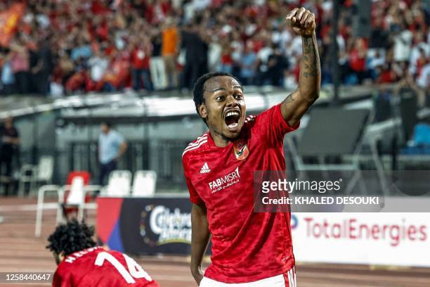 Ahly's South African forward Percy Tau celebrates after scoring a goal during the first-leg final football match of the CAF Champions League, between...
