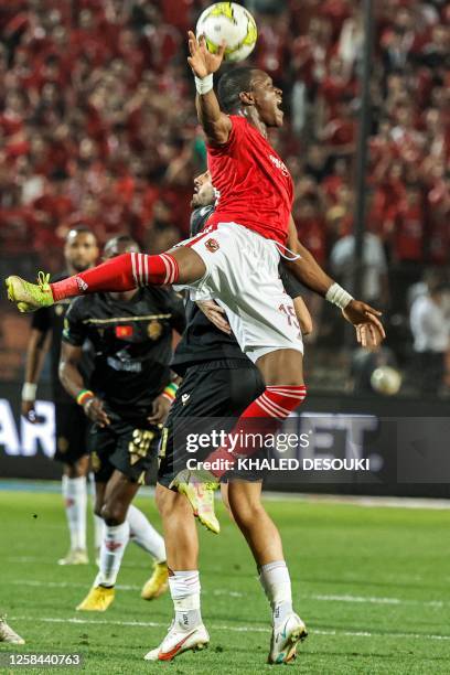 Ahly's Malian midfielder Aliou Dieng and Wydad's Moroccan forward Ayman el-Hassouni vie for the ball during the first-leg final football match of the...