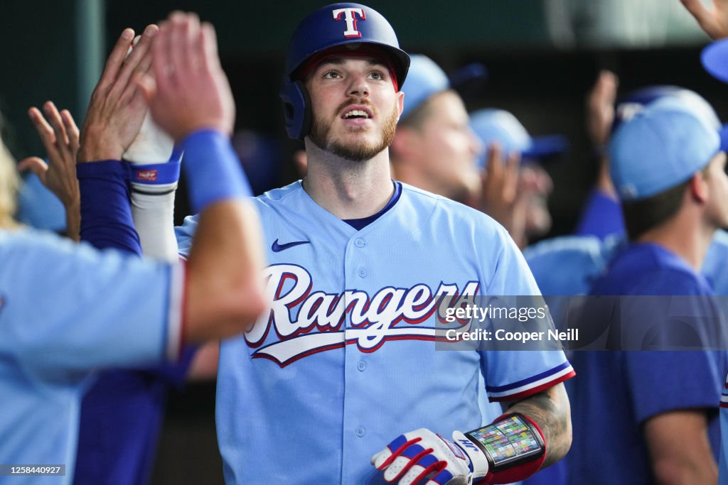 Texas Ranger Heim Jonah Heim of the Texas Rangers high-fives teammates in the dugout ...