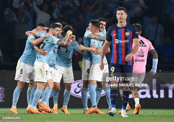 Celta de Vigo's players celebrate their win at the end of the Spanish league football match between RC Celta de Vigo and FC Barcelona at the Balaidos...