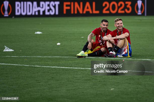 Suso and Ivan Rakitic of Sevilla FC smile after the award ceremony following the UEFA Europa League final football match between Sevilla FC and AS...